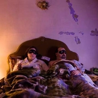 Man and woman lying in bed